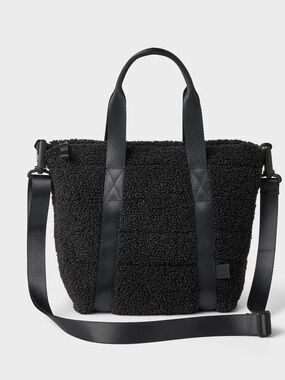 All in Motion black faux shearling tote bag